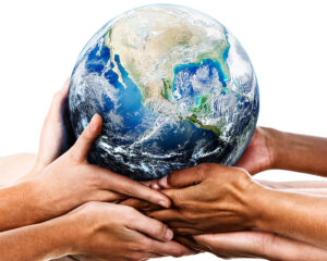 Hands holding the globe to support eco-conscious living